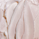 Close-up of smooth, light-colored cream texture