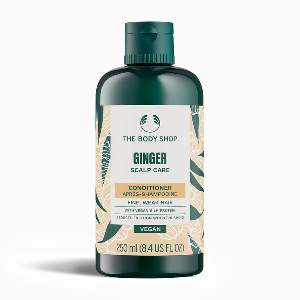 The Body Shop Ginger Scalp Care conditioner bottle on a white background