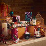 Cosmetic products with colorful packaging on a rustic stone surface.