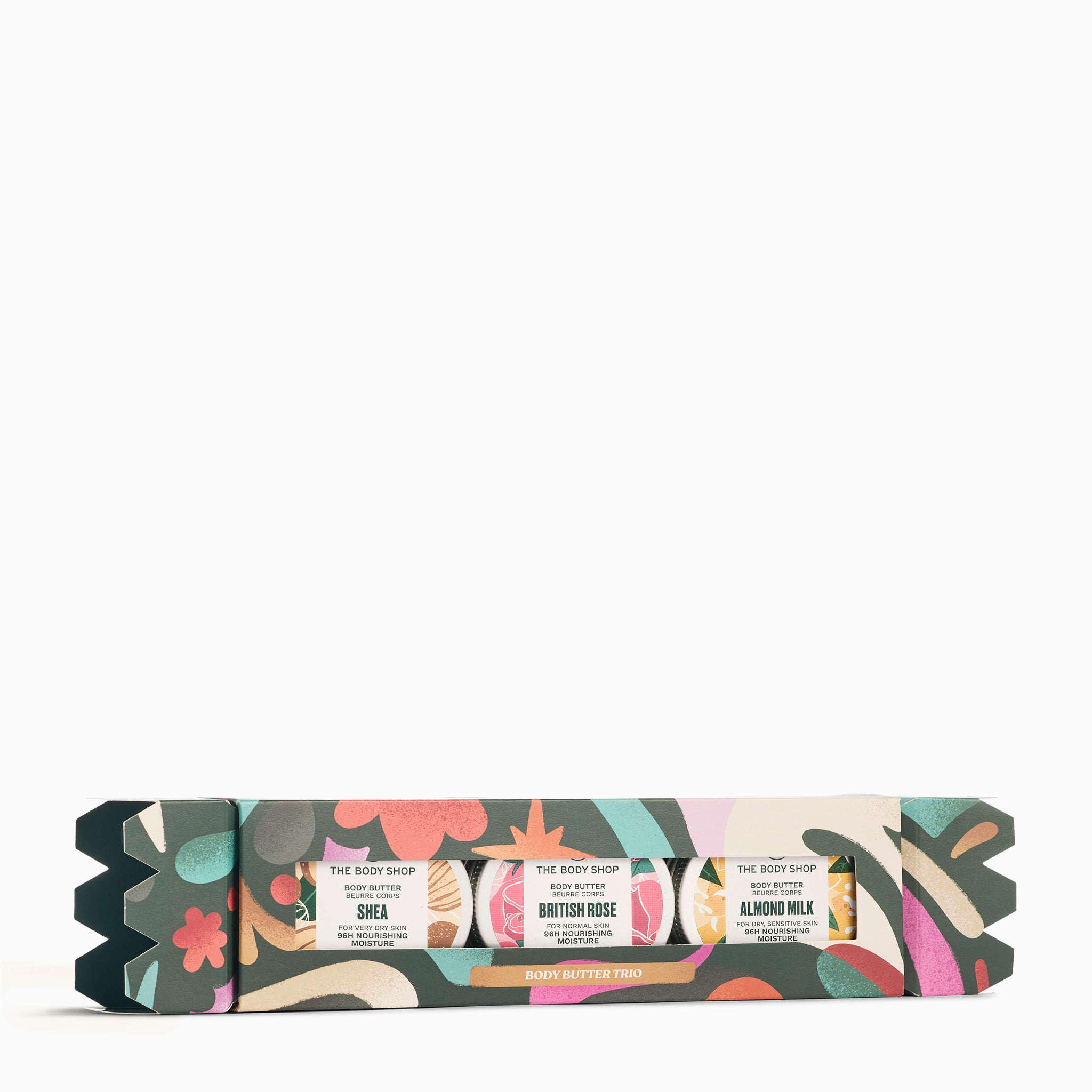 Set of The Body Shop body butter bars with colorful packaging on a white background