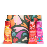 Three hand care products in front of a colorful abstract-patterned box