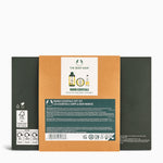Back view of a The Body Shop Mango Essentials gift set packaging on a white background