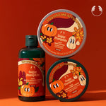 Set of 'You Had Me at Pumpkin' skincare products on an orange background