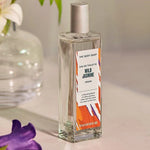 the body shop wild jasmine eau de toilette  product lifestyle image next to flowers