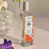 the body shop wild jasmine eau de toilette  product lifestyle image next to flowers