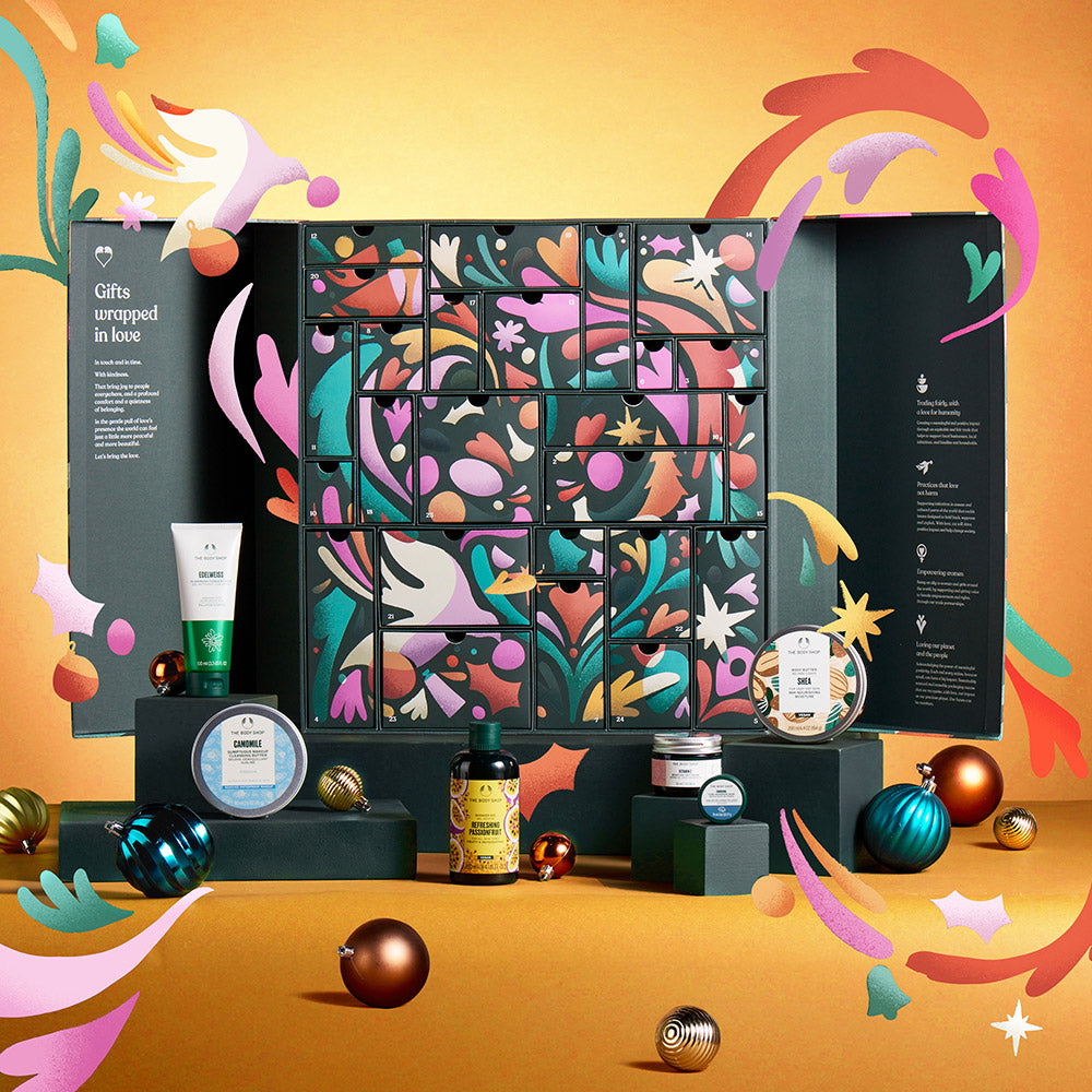 Cosmetic advent calendar with colorful design and products on an orange background