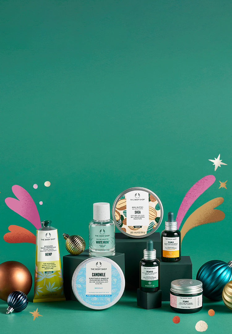 Collection of skincare products on a green background with decorative elements