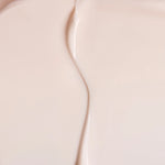 close up swatch of a light pink cream