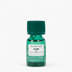 Tea Tree oil bottle from The Body Shop on a white background