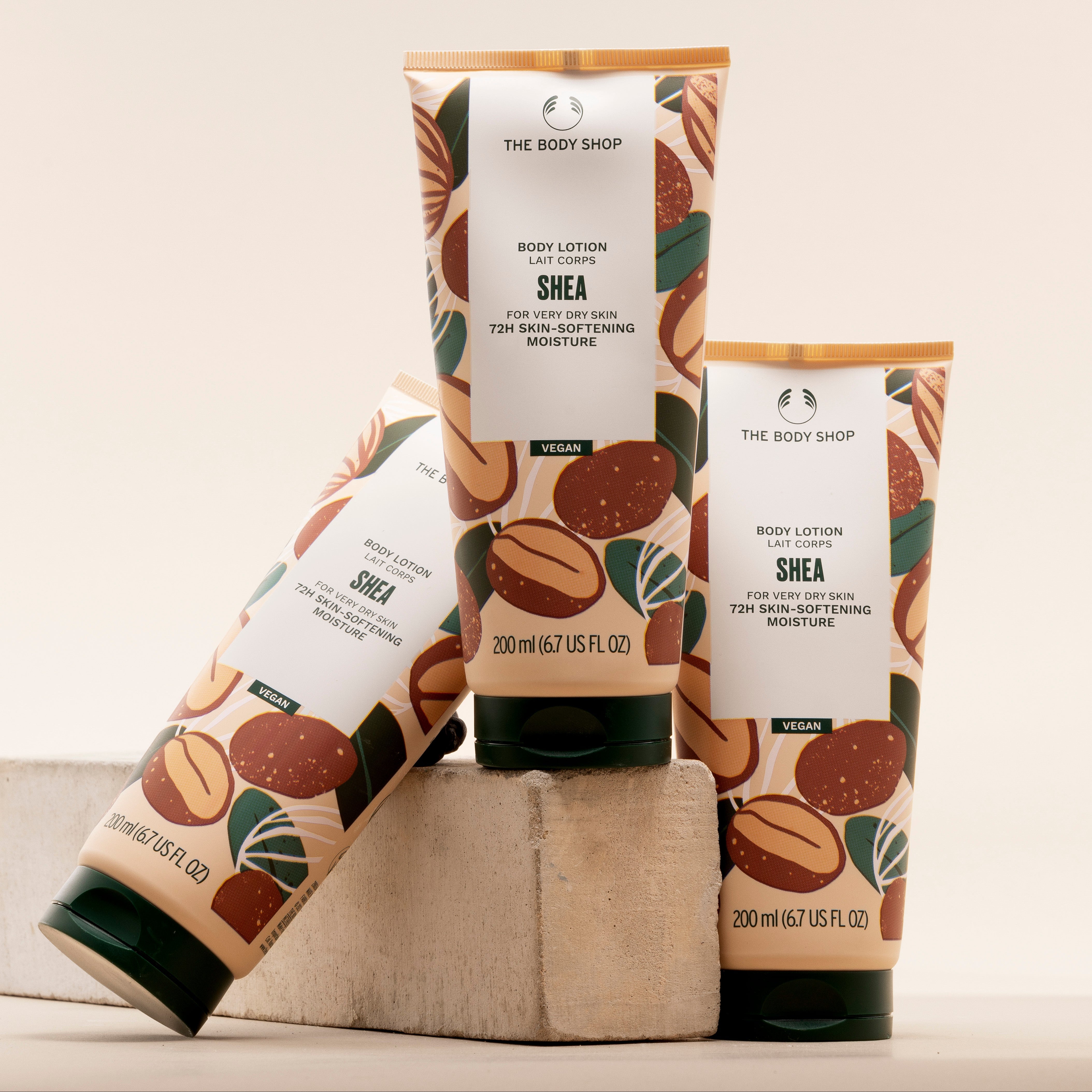 The Body Shop Shea body lotion with packaging on a light background