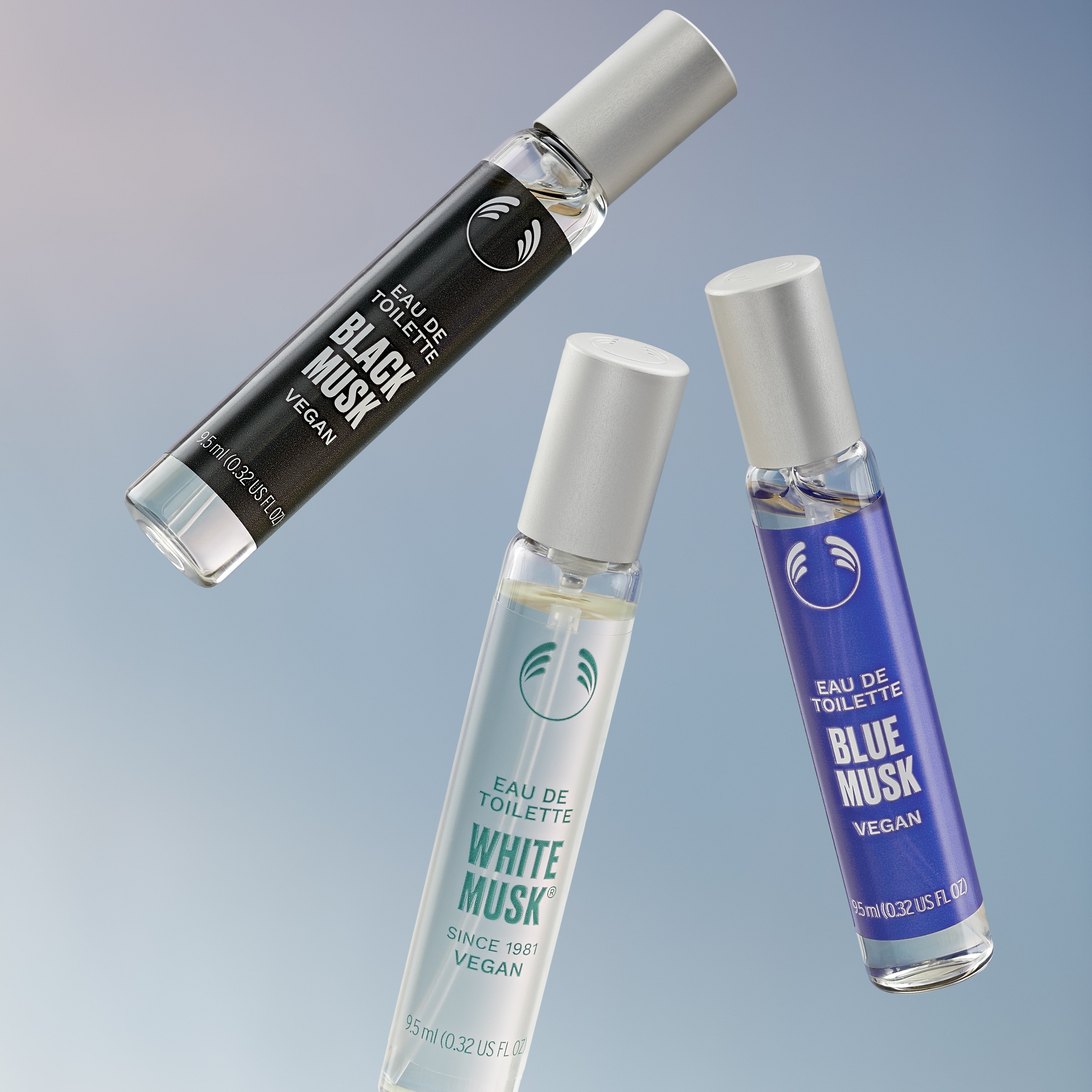 Three perfume bottles labeled 'Black Musk', 'White Musk', and 'Blue Musk' on a gradient background.