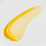 Yellow nail polish swatch on a white background