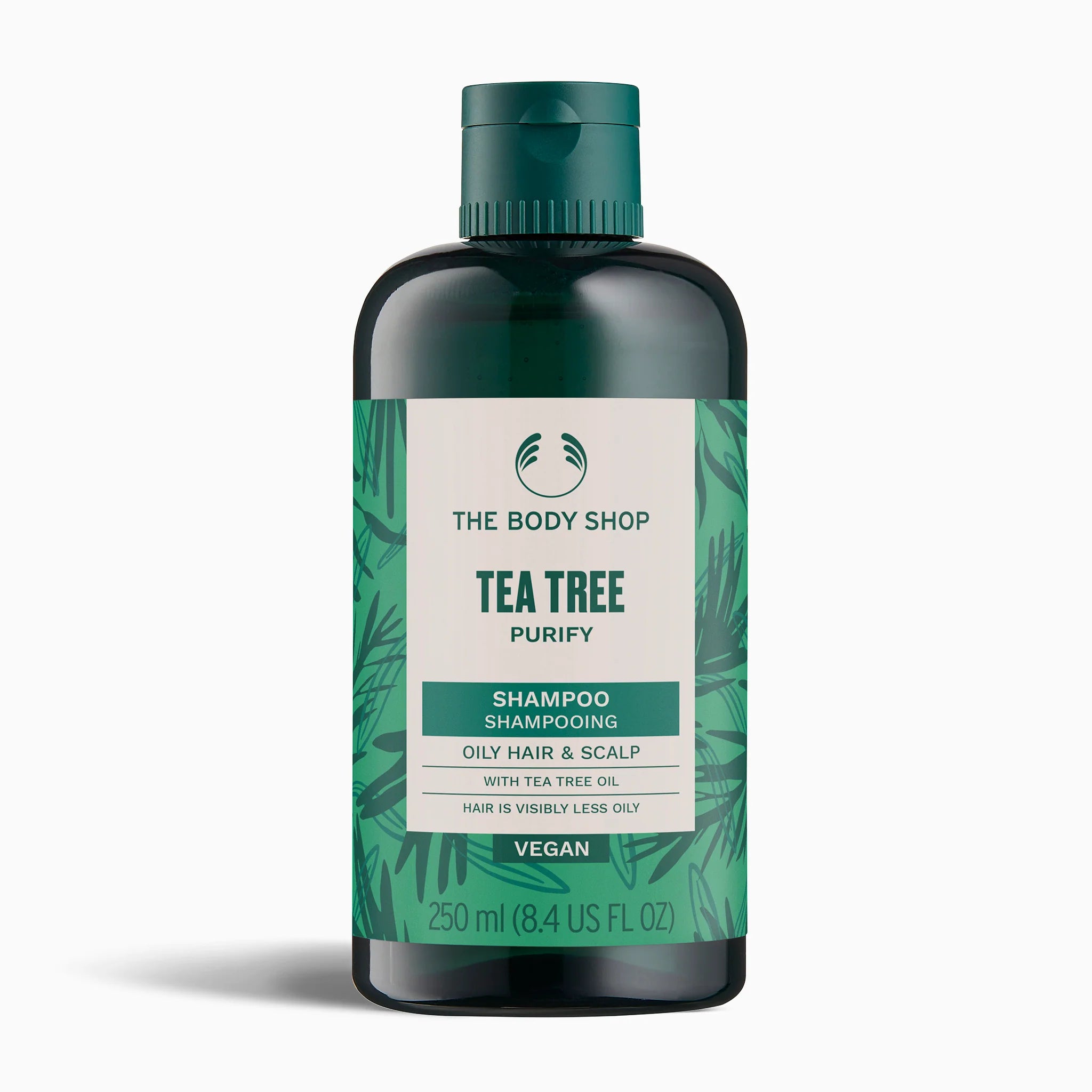 The Body Shop Tea Tree Shampoo bottle on a white background