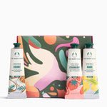 The Body Shop product set with colorful packaging and three bottles on a white background