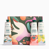 The Body Shop product set with colorful packaging and three bottles on a white background
