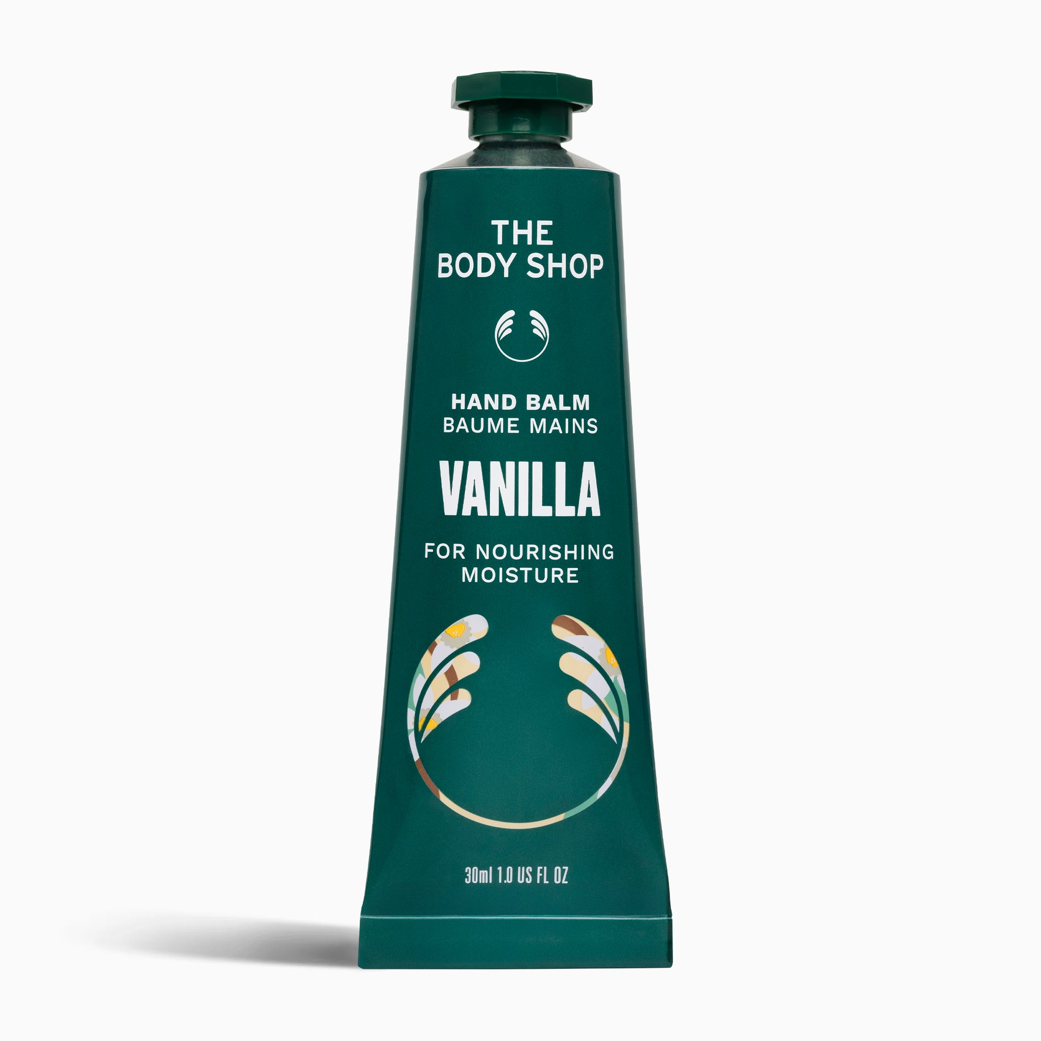 Green tube of The Body Shop Vanilla hand balm on a white background