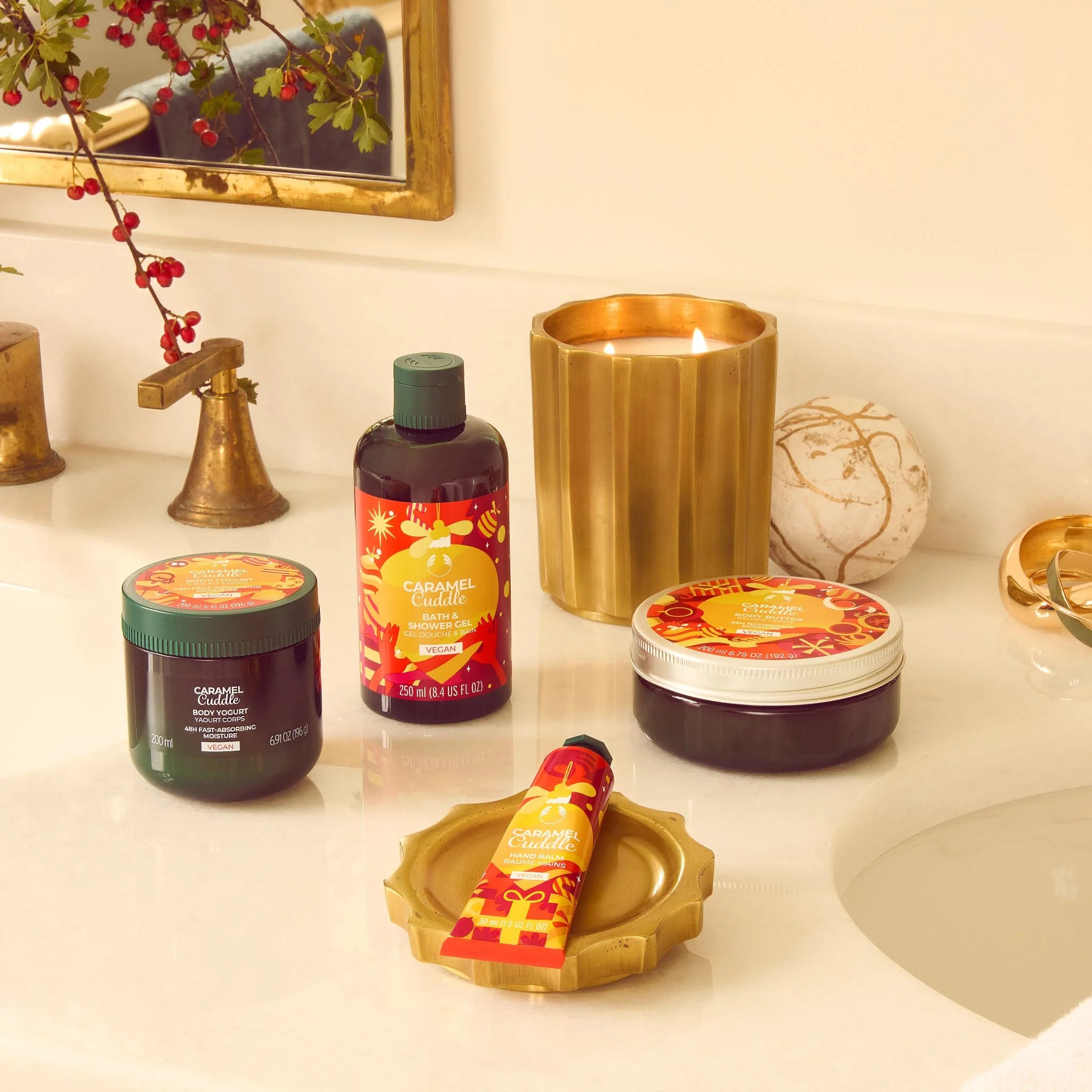Bathroom counter with Cala Luna products including a candle, jar, and bottle.