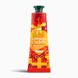 Caramel Cuddle hand balm tube on a white background