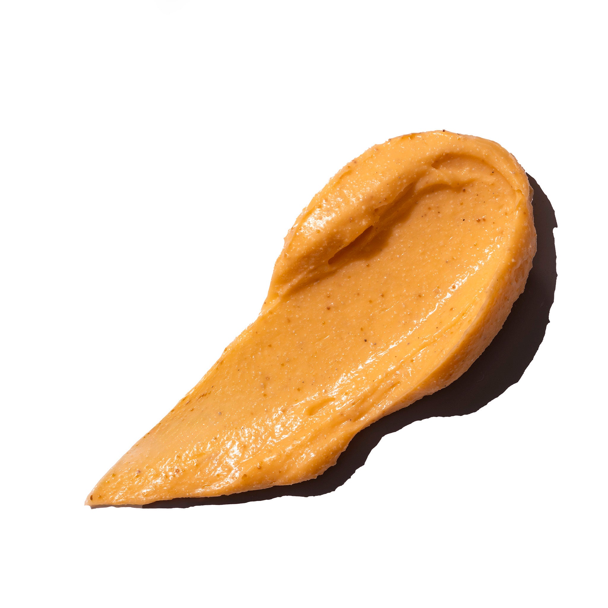 Texture of Sugar Pumpkin Body Scrub on a white background