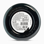 Back of a black jar with text and recycling information on a white background