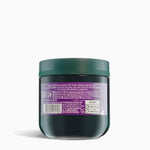 Dark green jar with a purple label on a white background
