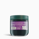 Dark green jar with a purple label on a white background