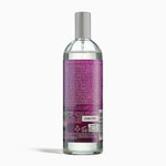 Clear bottle with purple label on a white background