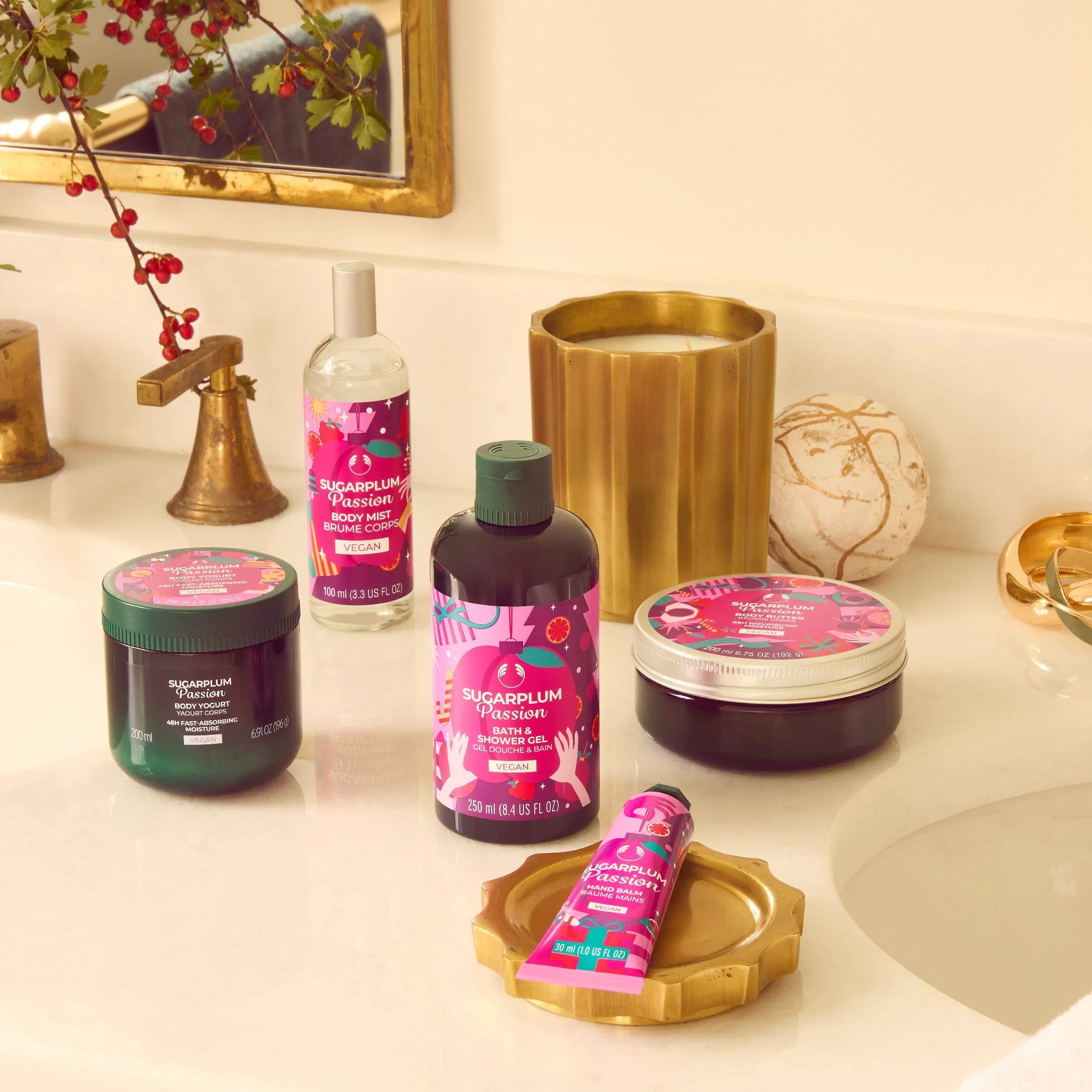 Bathroom counter with skincare products featuring pink and green packaging.