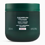 Green jar of Sugarplum Passion body yogurt on a white background