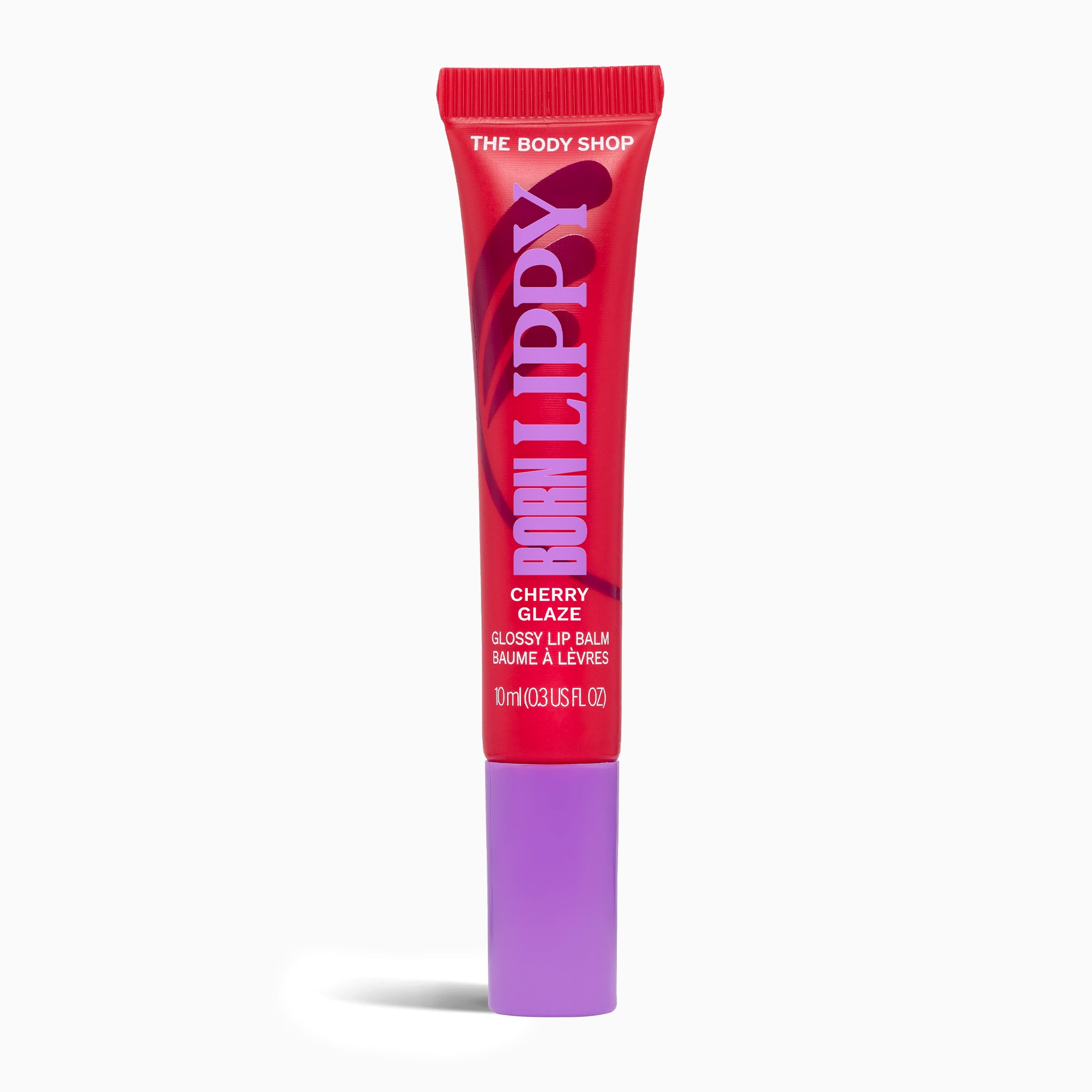 Lip balm tube with red and purple design on a white background
