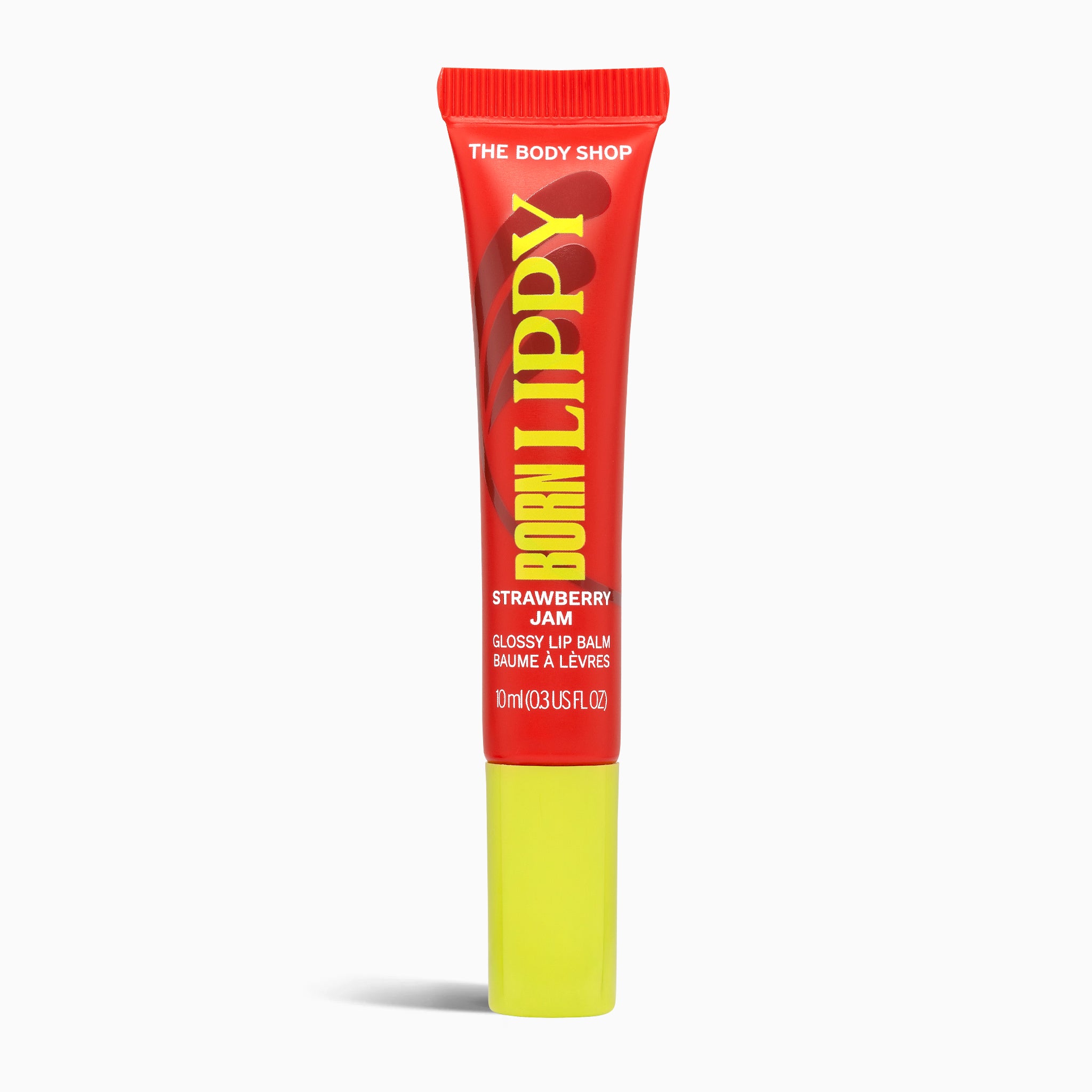 Red and yellow lip balm tube with 'The Body Shop' branding on a white background
