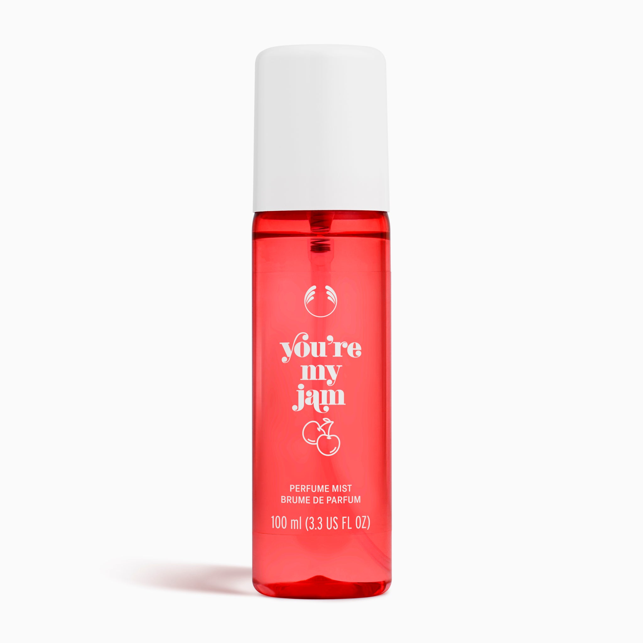 Red perfume mist bottle with white cap and text on a white background