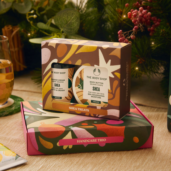 The Body Shop Shea Handcare Trio set with decorative packaging on a table.