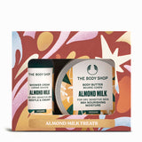 The Body Shop Almond Milk treats set with shower cream and body butter on a colorful box background.