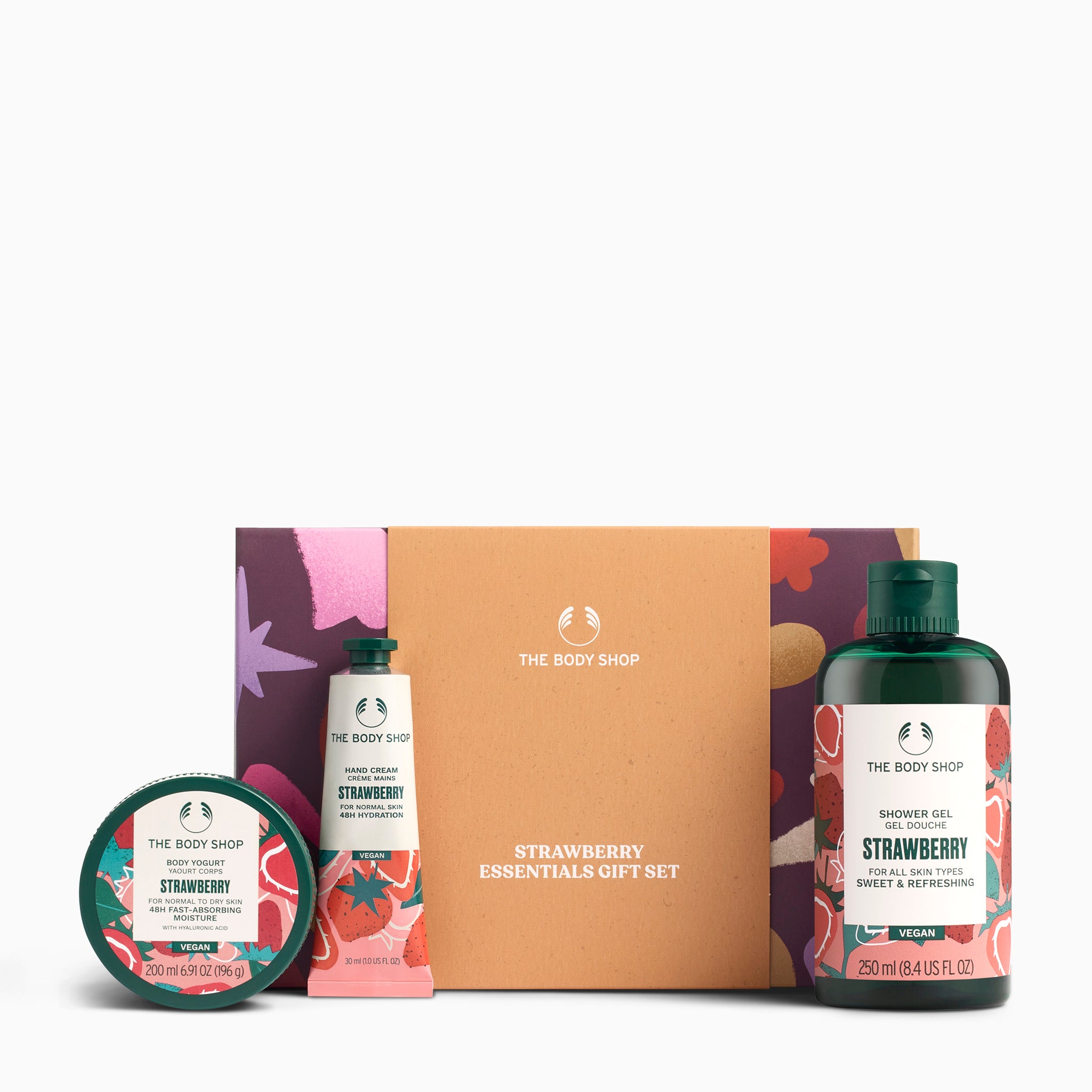 The Body Shop Strawberry Essentials gift set with products and packaging on a white background