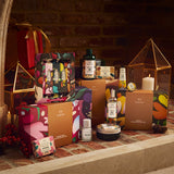 Collection of beauty products and packaging on a stone surface with a warm, rustic background.