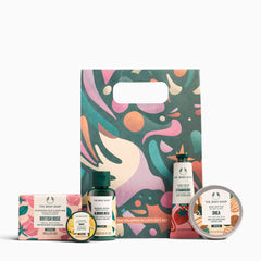 The Body Shop gift set with various products including a soap, lotion, and body butter on a white background.