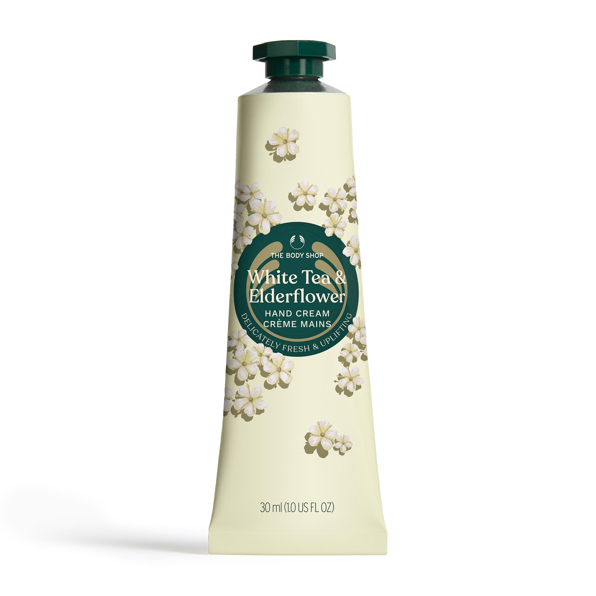 Hand cream tube labeled 'White Tea & Elderflower' by The Body Shop on a white background