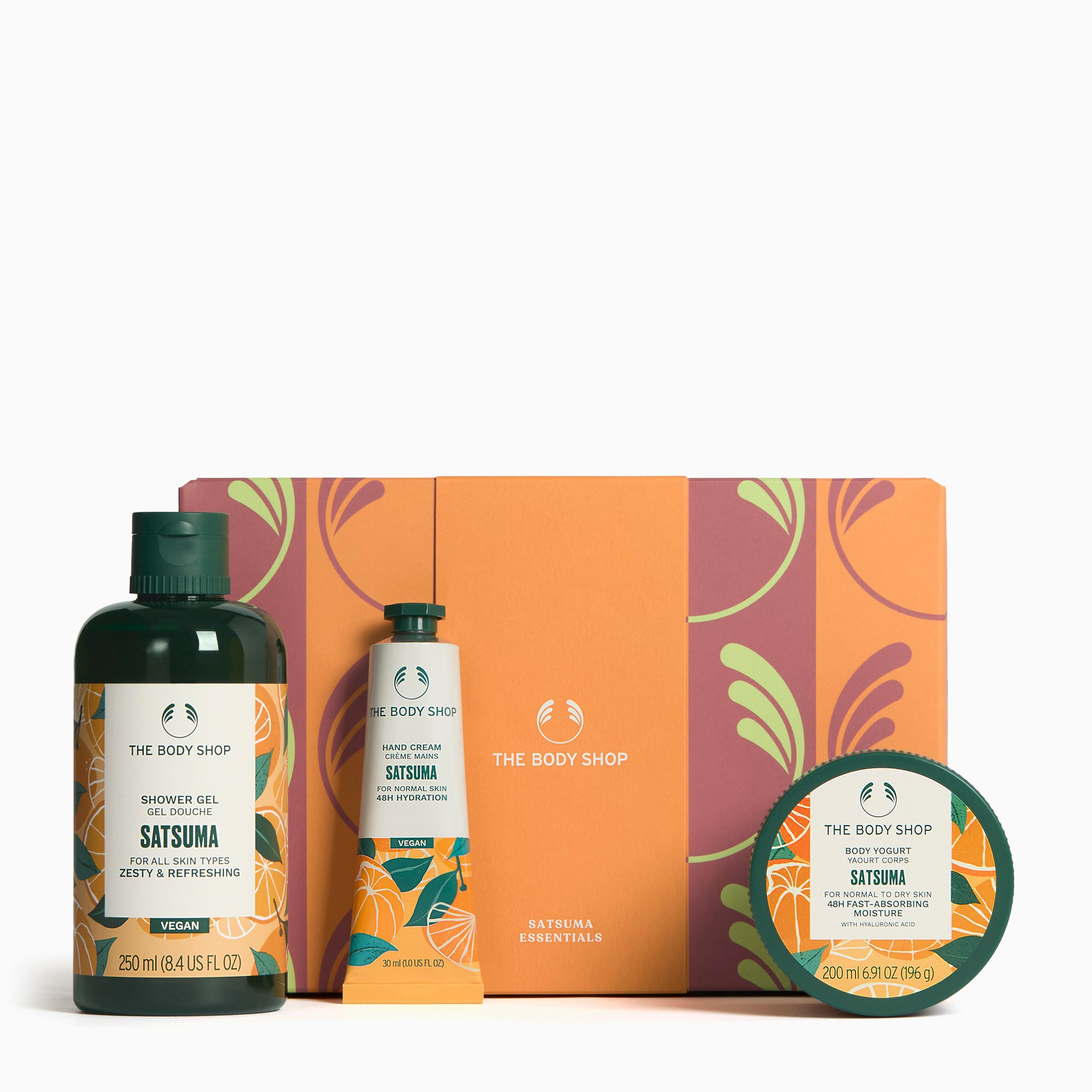 The Body Shop Satsuma essentials set with shower gel, hand cream, and body butter on a white background.