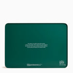 Green product packaging with text and recycling symbols on a white background