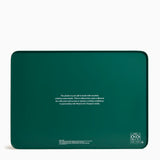 Green product packaging with text and recycling symbols on a white background