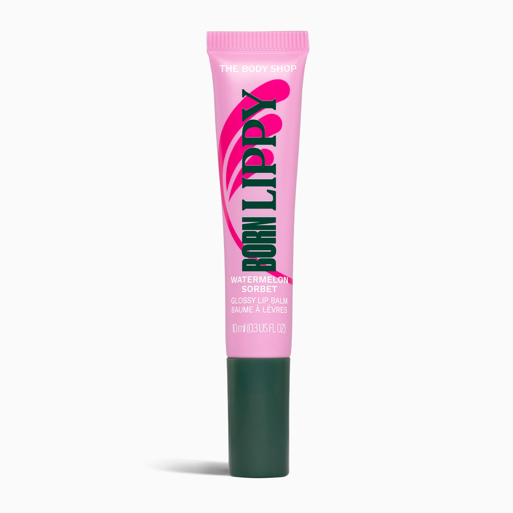 Pink lip balm tube with green cap on a white background