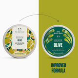 The Body Shop Olive Body Butter tins shown side by side on a split white and olive-green background, with a dotted arrow pointing from the left label to the right label and the text 'IMPROVED FORMULA' below.