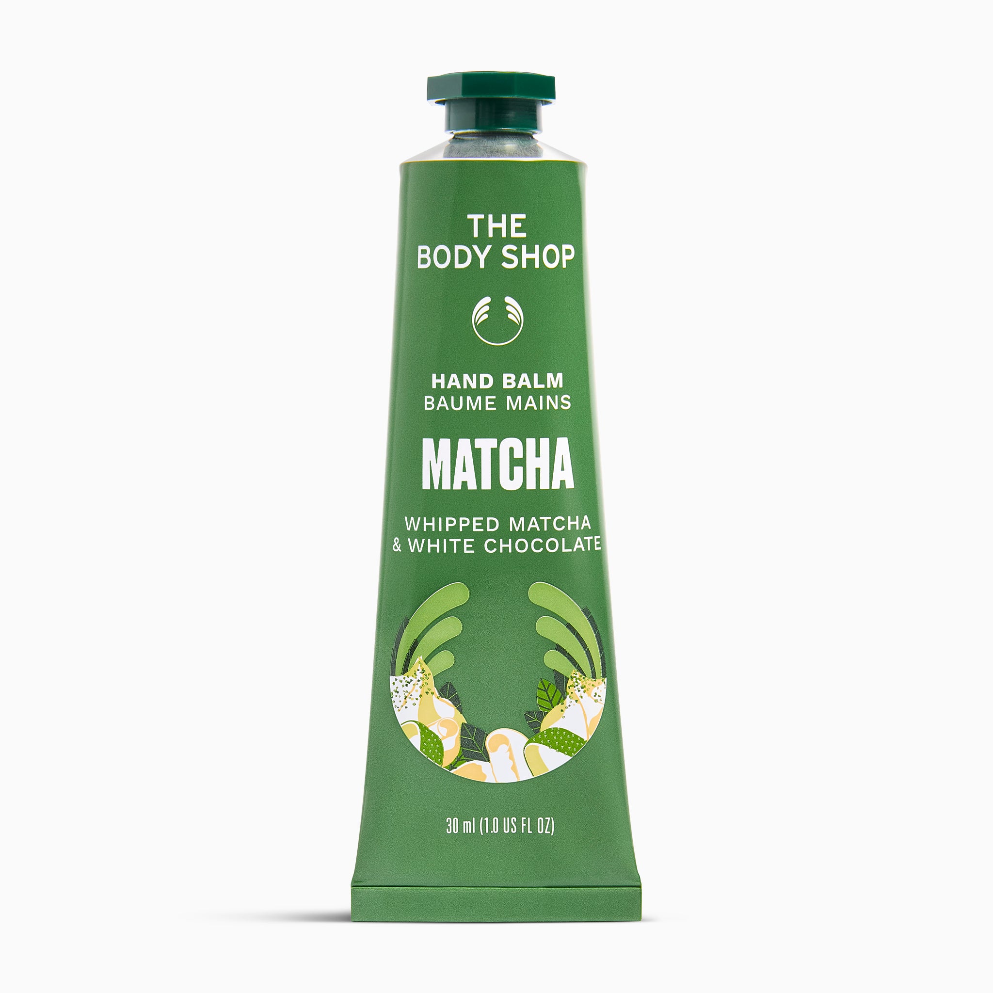 A squeeze tube of The Body Shop Hand Balm in Matcha flavor, featuring a green body with white text and illustrations of matcha leaves and chocolate pieces, set against a plain white background.