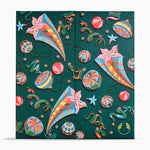 A double-door refrigerator or cabinet featuring a colorful Christmas-themed paper cutout style print on a dark green background, with ornaments, streamers, stars, and festive motifs.