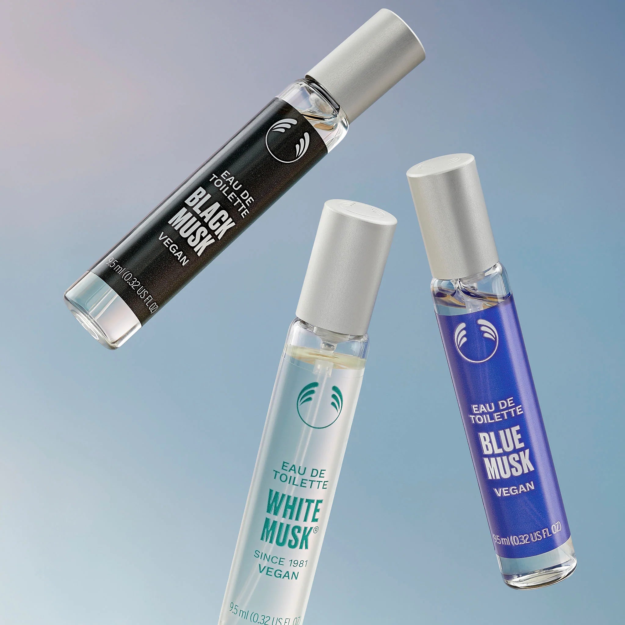 Three small perfume bottles labeled 'Black Musk', 'White Musk', and 'Blue Musk' on a gradient background.
