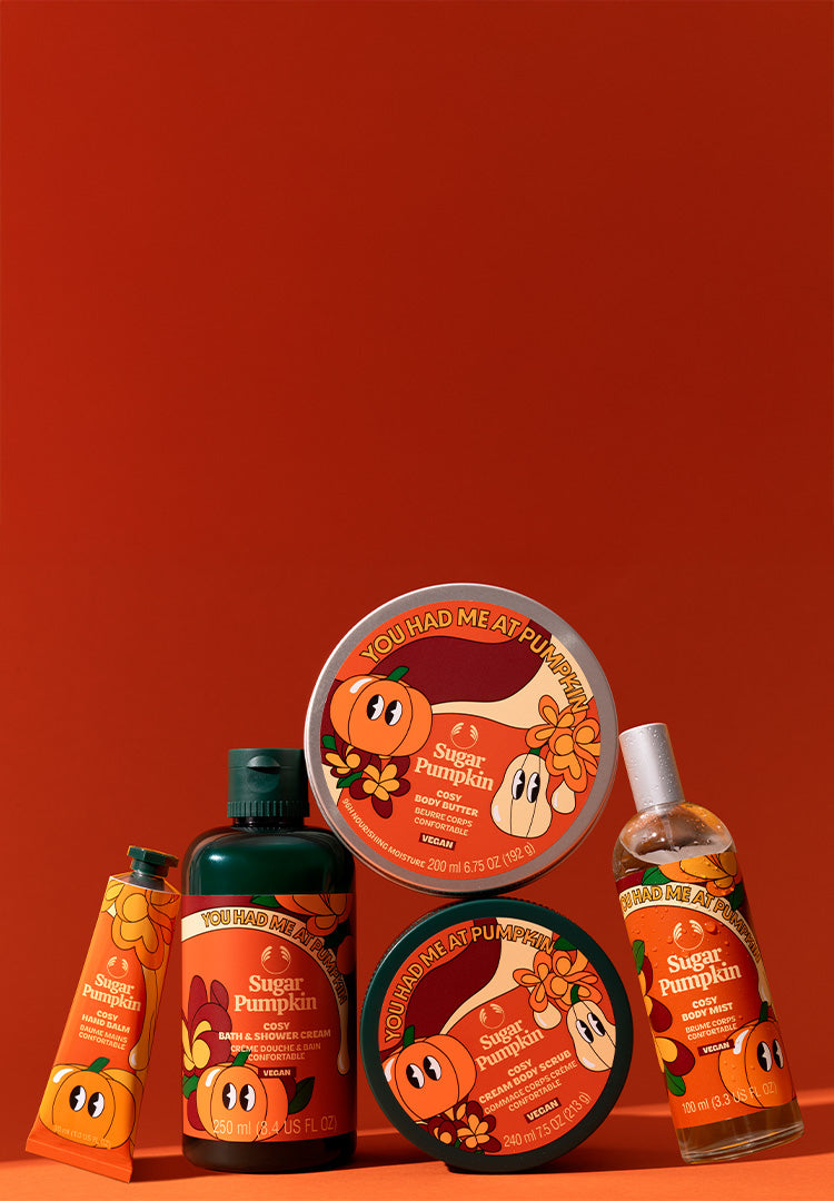 Collection of 'Sugar Pumpkin' themed skincare products on an orange background