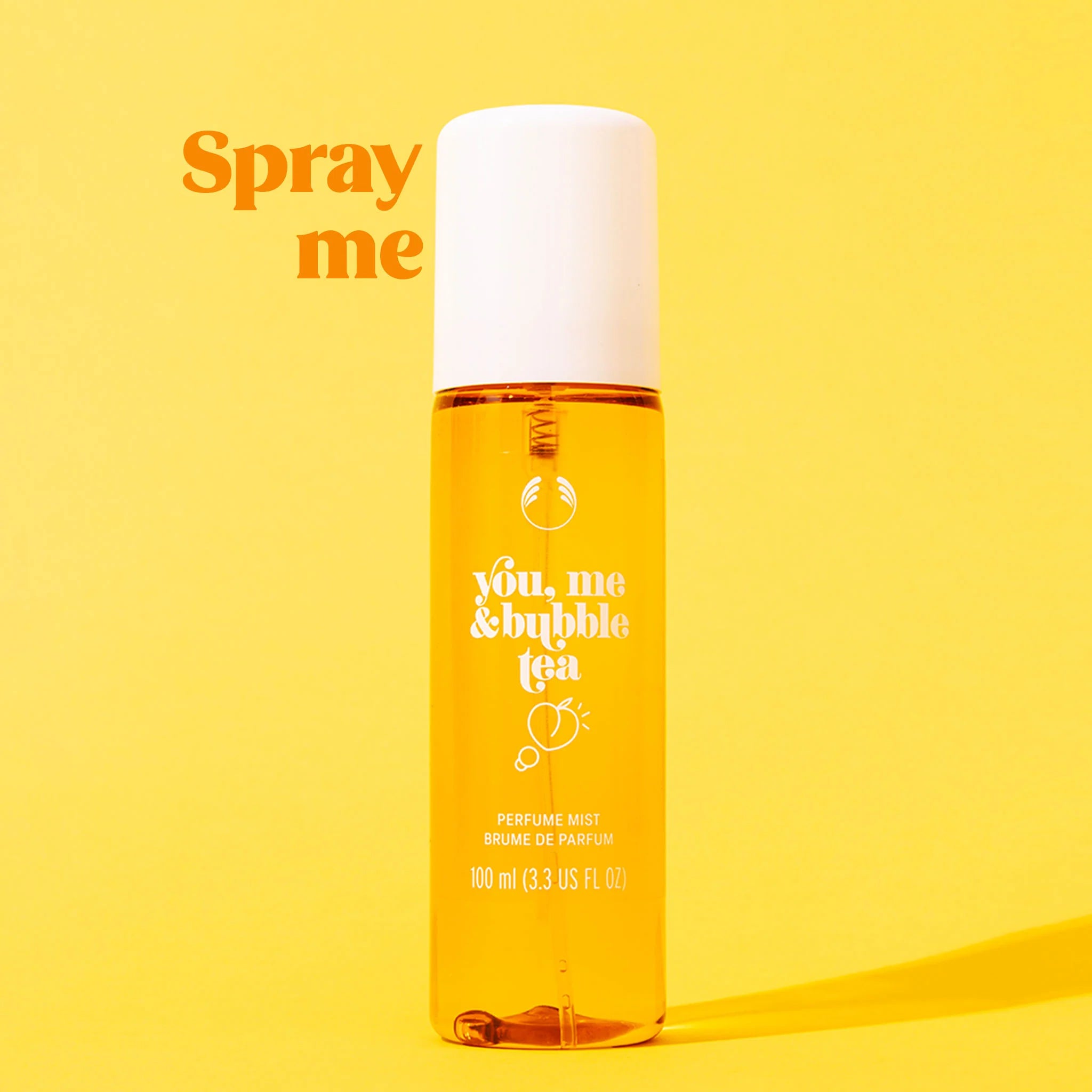 Perfume bottle labeled 'you, me & bubble tea' on a yellow background with text 'Spray me'.