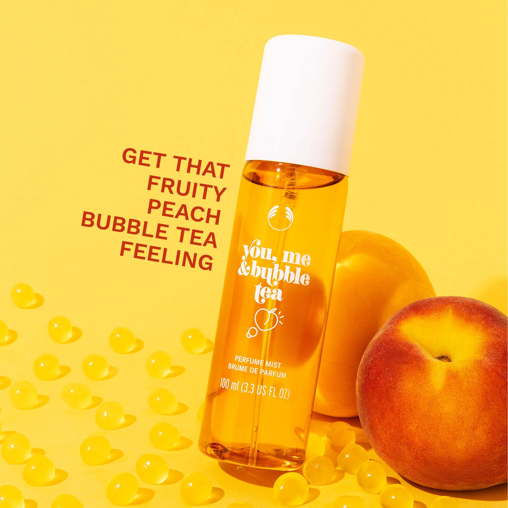 Perfume bottle labeled 'you, me & bubble tea' with a peach and text on a yellow background