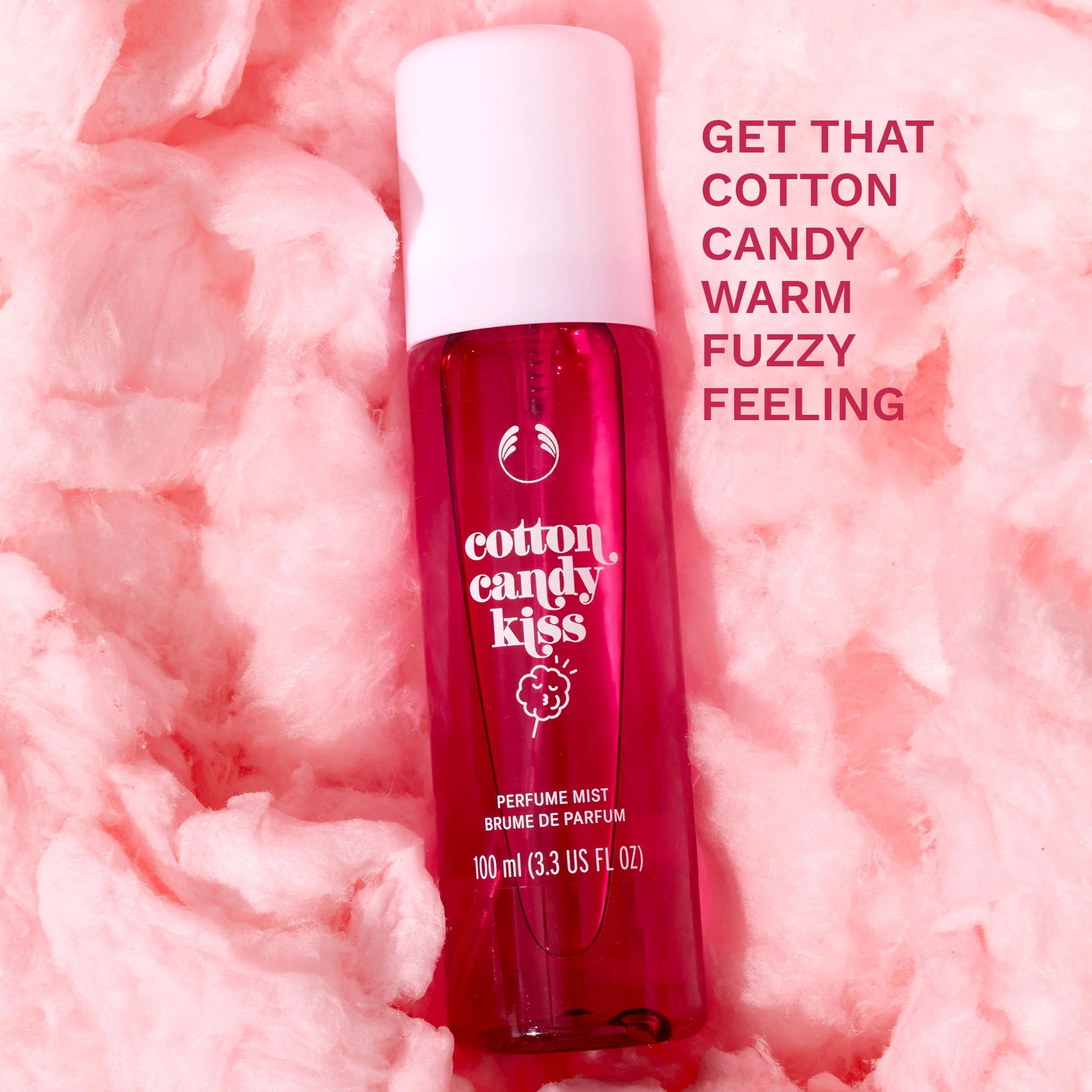 Perfume mist bottle labeled 'cotton candy kiss' on a pink cotton candy background with text.